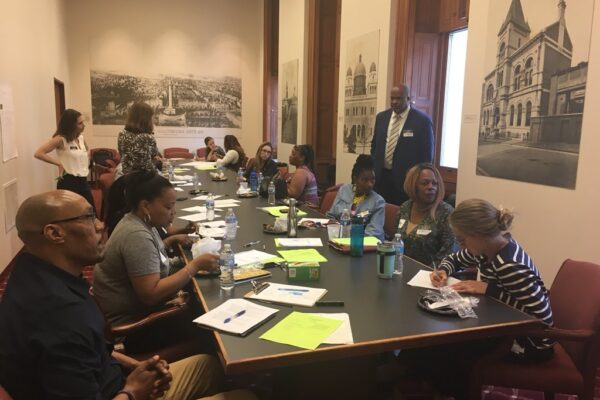 Community health care workers at city hall discussing their challenges to deliver resources to their communities.