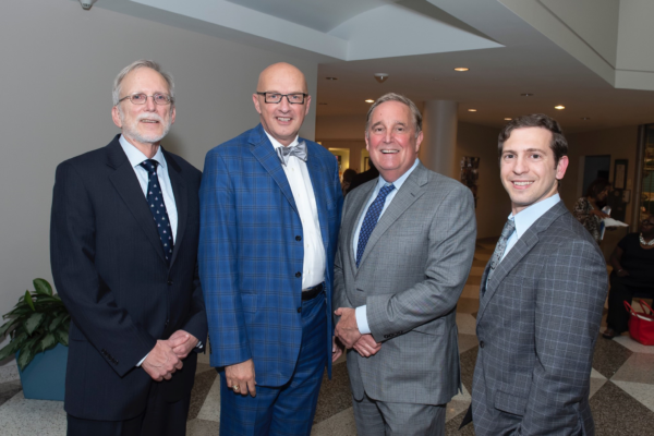 May 30, 2018 -- Book reveal for "Building Healthy Communities Through Medical Religious Partnerships"(L to R): Auth. Daniel Hale (PhD), Pres. Kevin Sowers (MSN, RN, FAAN), Richard Bennett (MD), Auth. Panagis Galiatsatos (MD)