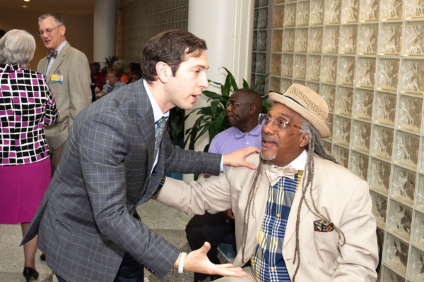 May 30, 2018 -- Dr. Galiatsatos greeting a member of the community who commonly works with MGG